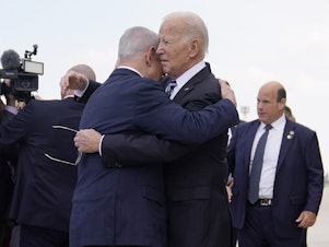 caption: President Biden greets Israeli Prime Minister Benjamin Netanyahu at Ben Gurion International Airport on Wednesday, Oct. 18, 2023, in Tel Aviv.