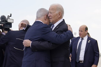 caption: President Biden greets Israeli Prime Minister Benjamin Netanyahu at Ben Gurion International Airport on Wednesday, Oct. 18, 2023, in Tel Aviv.