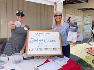 caption: Volunteers with the Fair Vote Washington campaign work to inform voters about ranked choice voting in San Juan County.