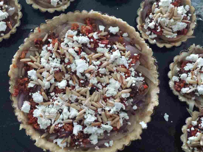 caption: Brenda Abdelall's goat cheese and onion tart is a yearly Thanksgiving staple, and draws on flavors from her Egyptian heritage. She calls it her version of "American pie."