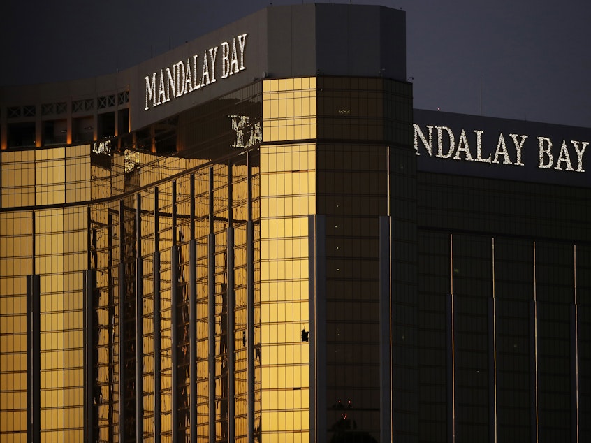 caption: MGM Resorts International has agreed to pay up to $800 million to settle thousands of liability claims stemming from the 2017 mass shooting in Las Vegas. The shooter holed up in a room on the 32nd floor of the MGM-owned Mandalay Bay hotel.