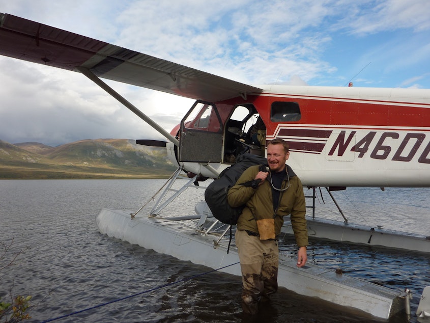 caption: Host Chris Morgan being picked up by float plane in an incredibly isolated area of the Brooks Range in northern Alaska.
