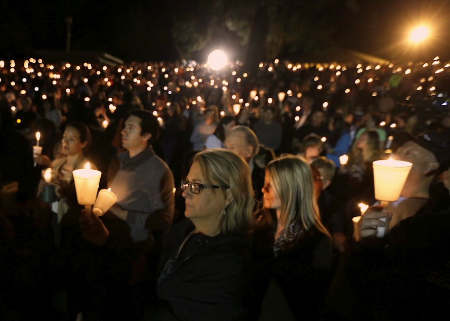 caption: Community members gather for a candlelight vigil for those killed in a shooting at Umpqua Community College in Roseburg, Ore., Thursday, Oct. 1, 2015.