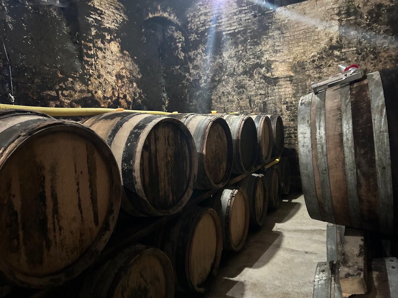 caption: Champagne barrels line the deep, cool cellars of Charles Fourny's estate in Vertus, France. Fourny says President Trump's impending tariffs has taken away his trust in the U.S. market.