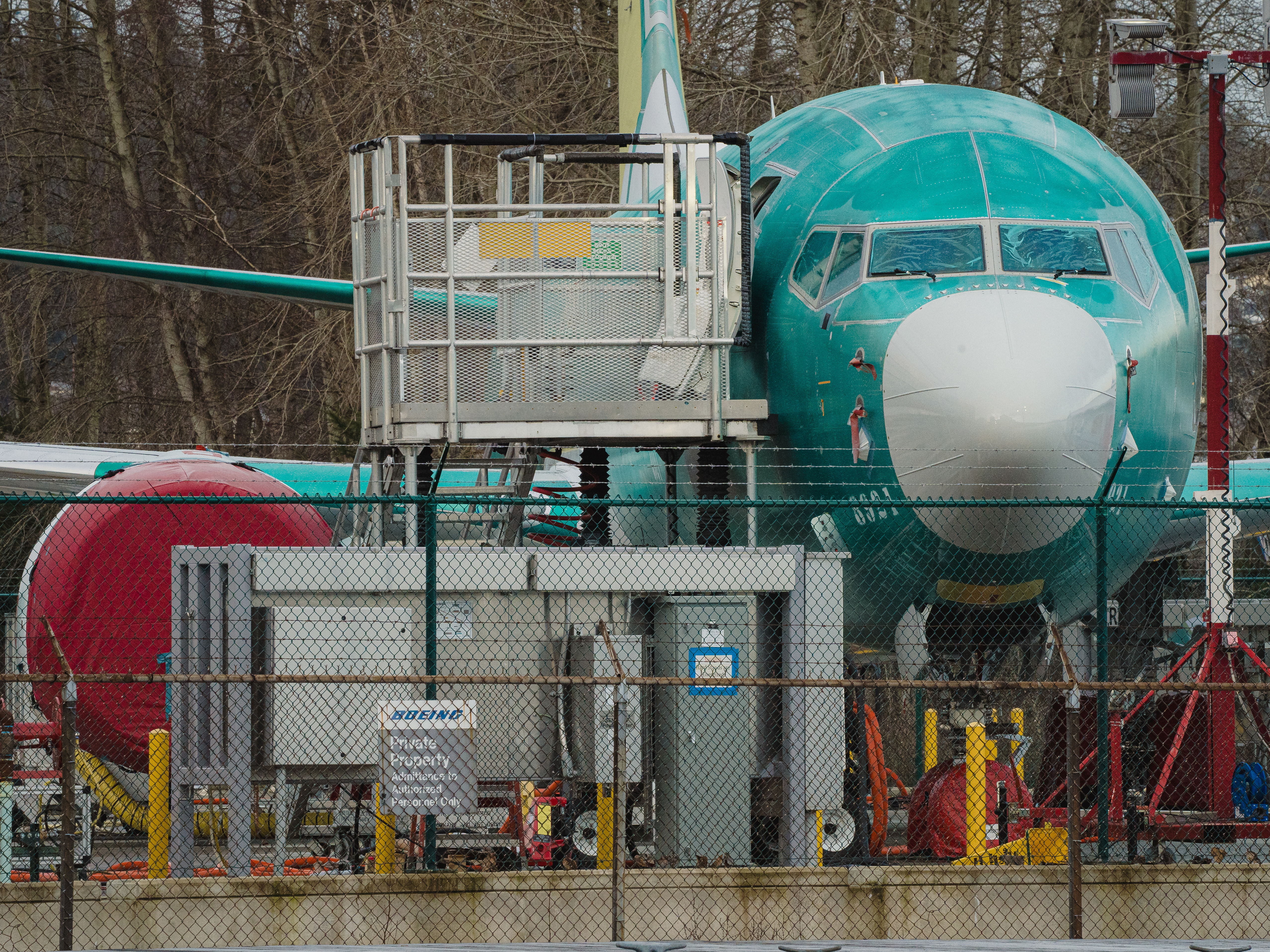 caption: A unfinished Boeing 737 Max sits outside Boeing's manufacturing facility in Renton, Wash., on Feb. 27, 2024. The top federal safety investigator says Boeing still has not provided key information that could shed light on what went wrong when a door plug blew off an in-flight 737 Max 9 in January.