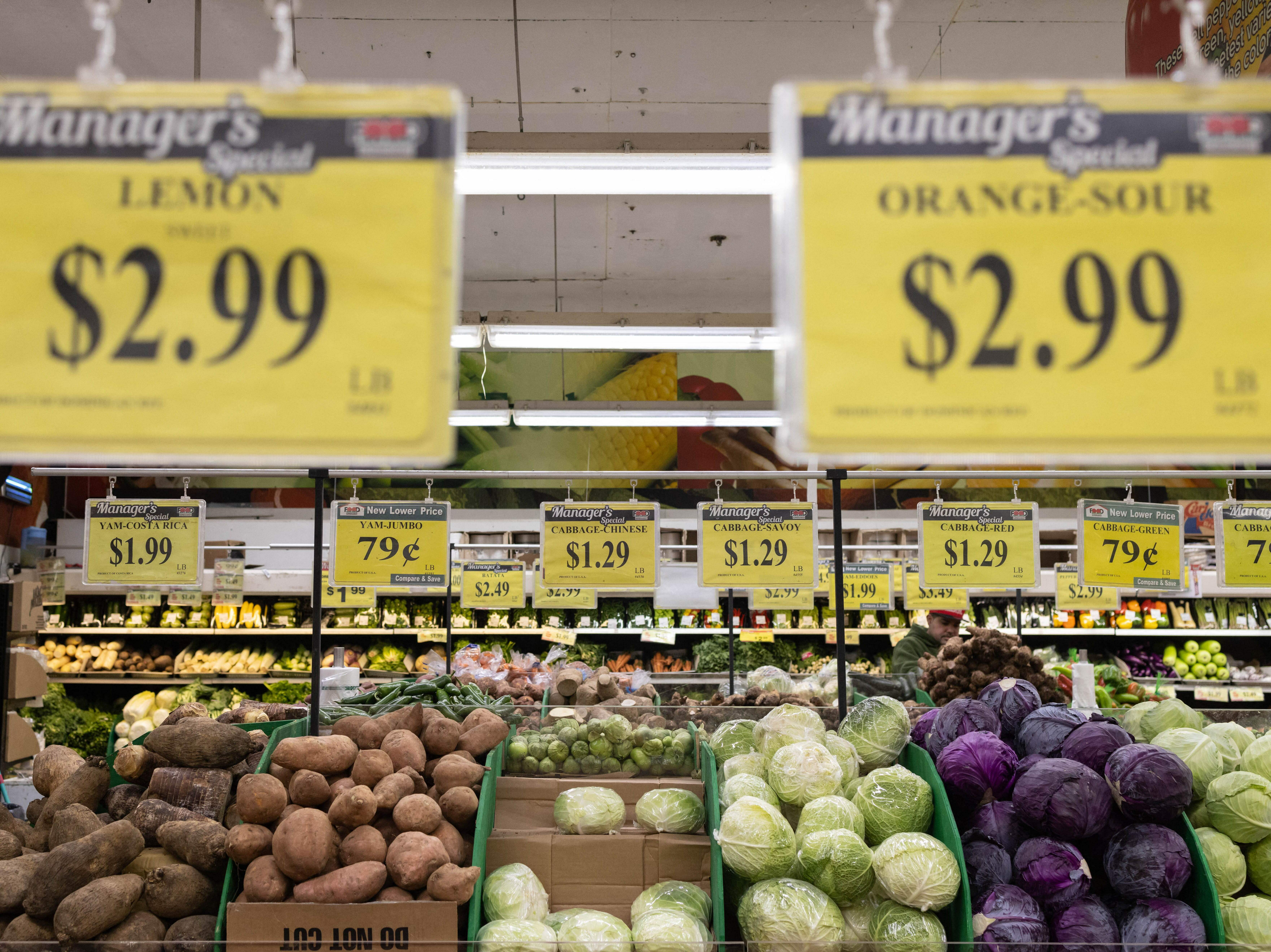 caption: Price tags are displayed at a New York City supermarket  on Dec. 14. Inflation has eased recently, but more evidence is needed to show that price increases are coming down in the long term, Fed Chair Powell said Wednesday.