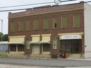 caption: The offices of the <em>Marion County Record</em> sit across from the Marion County Courthouse in Marion, Kan., on Sunday.