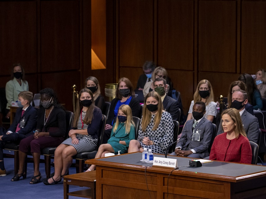 caption: Supreme Court nominee Judge Amy Coney Barrett responds to a question on the second day of her Supreme Court confirmation hearing Tuesday in Washington, D.C.