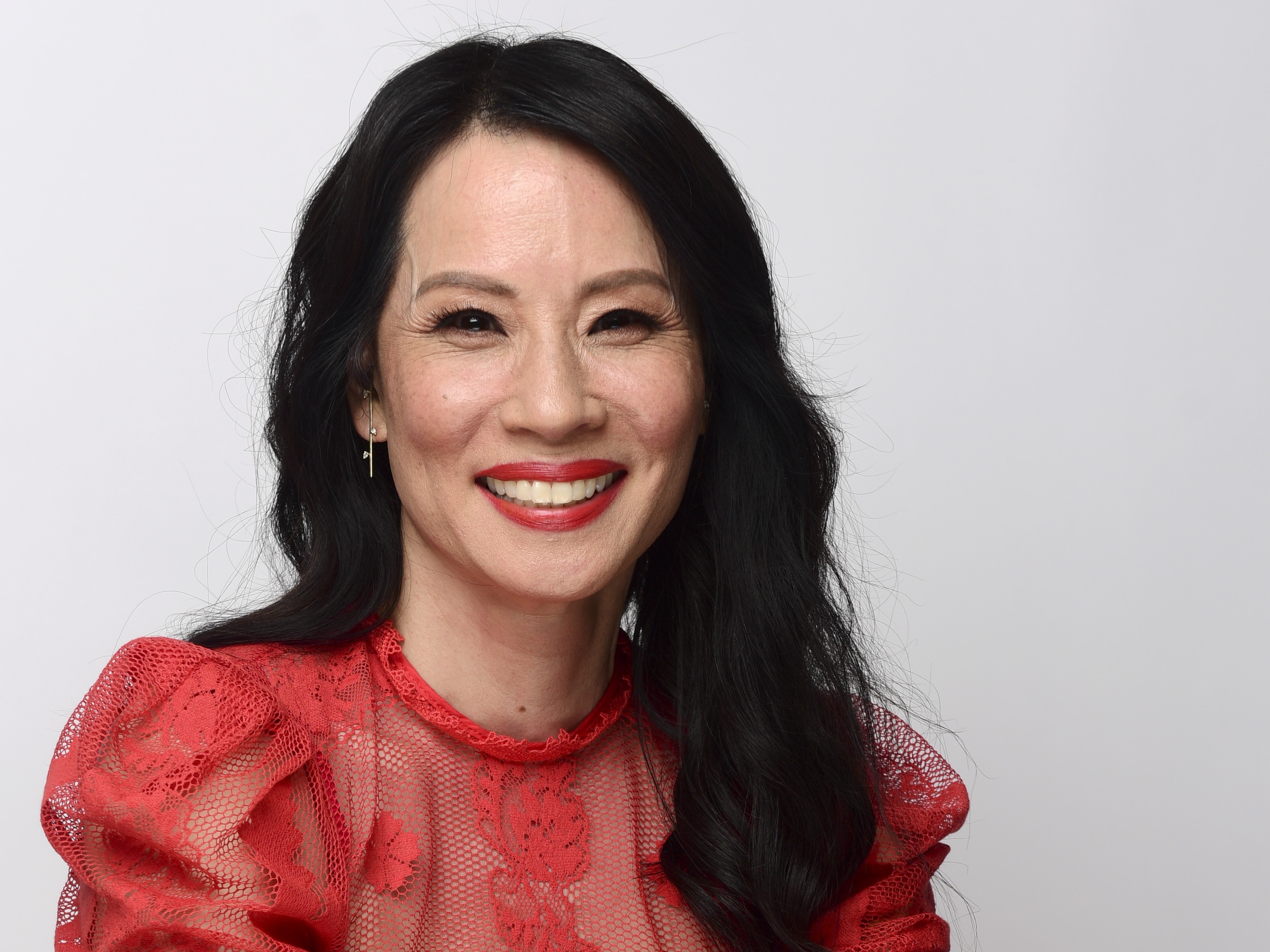 caption: Lucy Liu, shown here in 2022, grew up speaking Mandarin at home. She returns to the language in her new film, <em>Rosemead</em>.