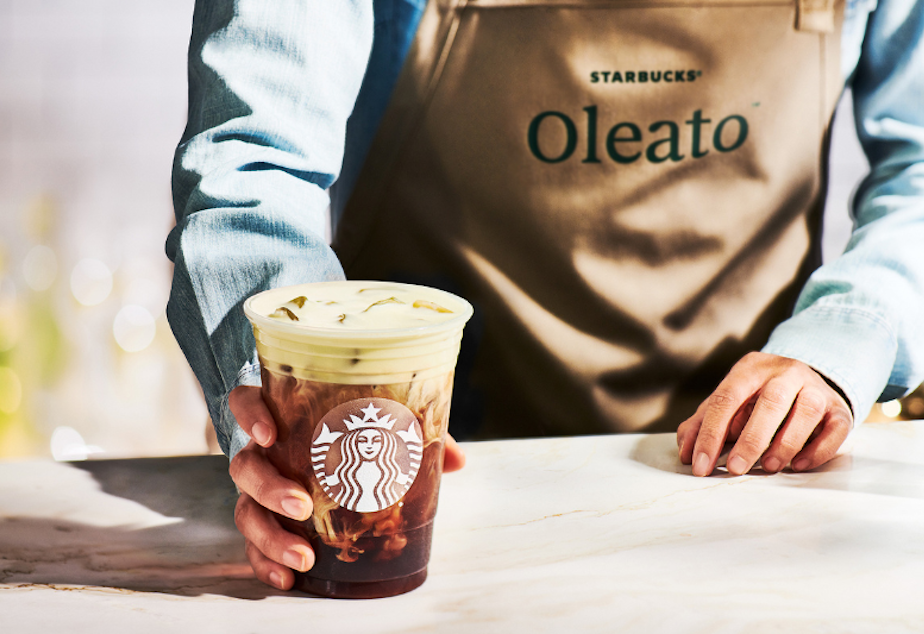 caption: Starbucks debuted its Oleato line of coffee drinks on Feb. 22, 2023 in Milan, Italy. Oleato adds olive oil to Starbucks drinks like lattes, cortados, or even an espresso martini.