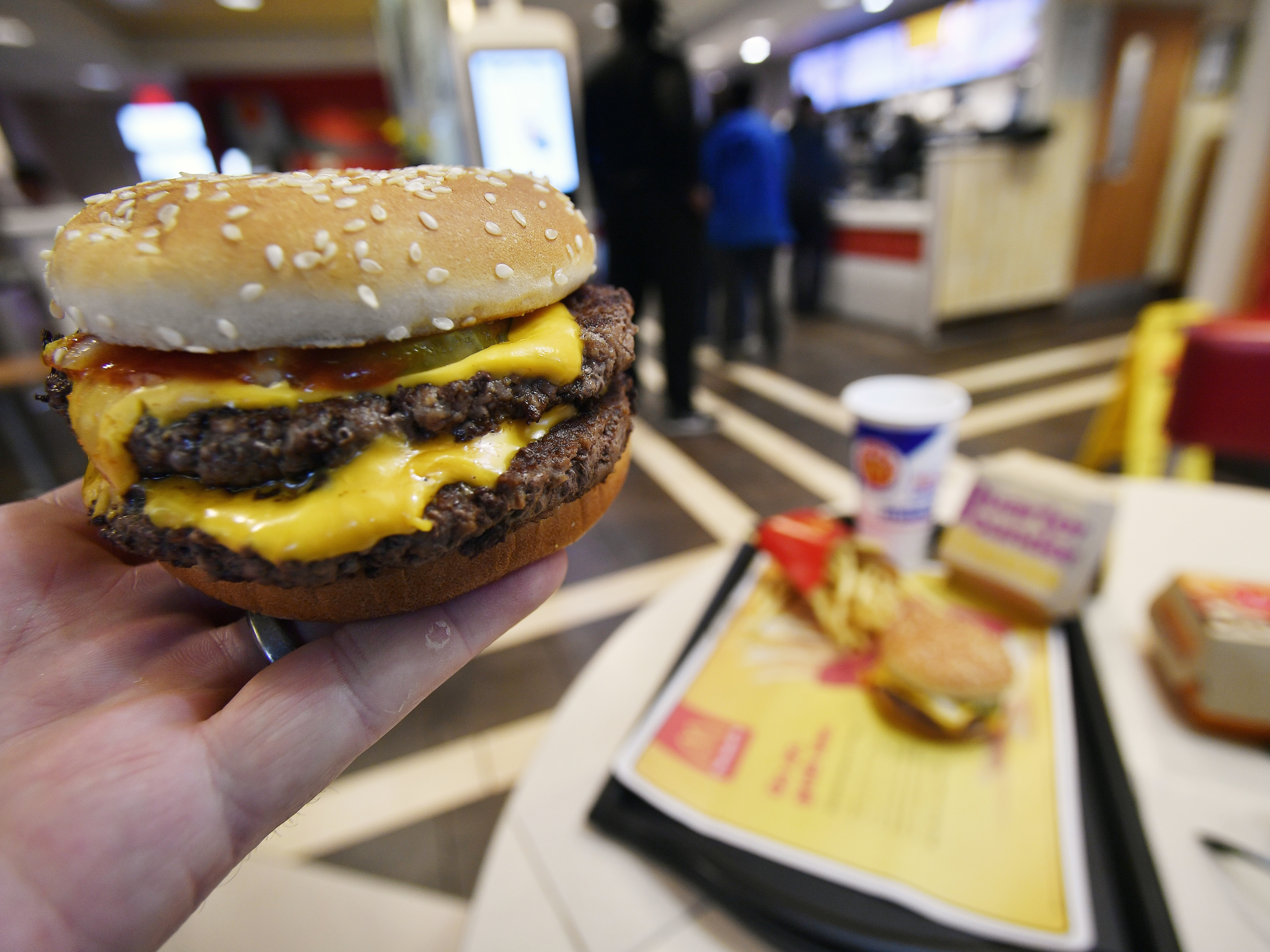 caption: A McDonald's Double Quarter Pounder is shown on March 6, 2018, in Atlanta. The fast-food chain says customers should feel confident ordering from its restaurants despite a deadly E. coli outbreak linked to its Quarter Pounder hamburgers.