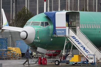 caption: An unpainted Boeing 737 Max 8 is parked at Renton Municipal Airport adjacent to Boeing's factory in Renton, Wash. on January 25, 2024. Boeing is still reeling from the fallout of an Alaska Airlines 737 Max 9 which lost a part of its fuselage in mid-flight earlier in the month.