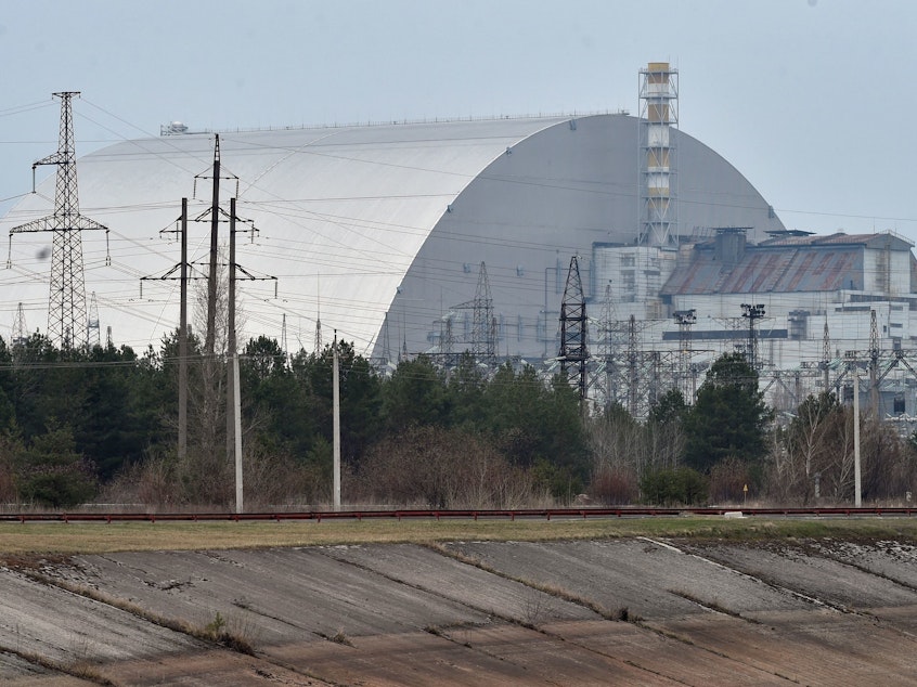 caption: Following the nuclear disaster at the Chernobyl plant in 1986, a protective dome was built over the destroyed fourth reactor.
