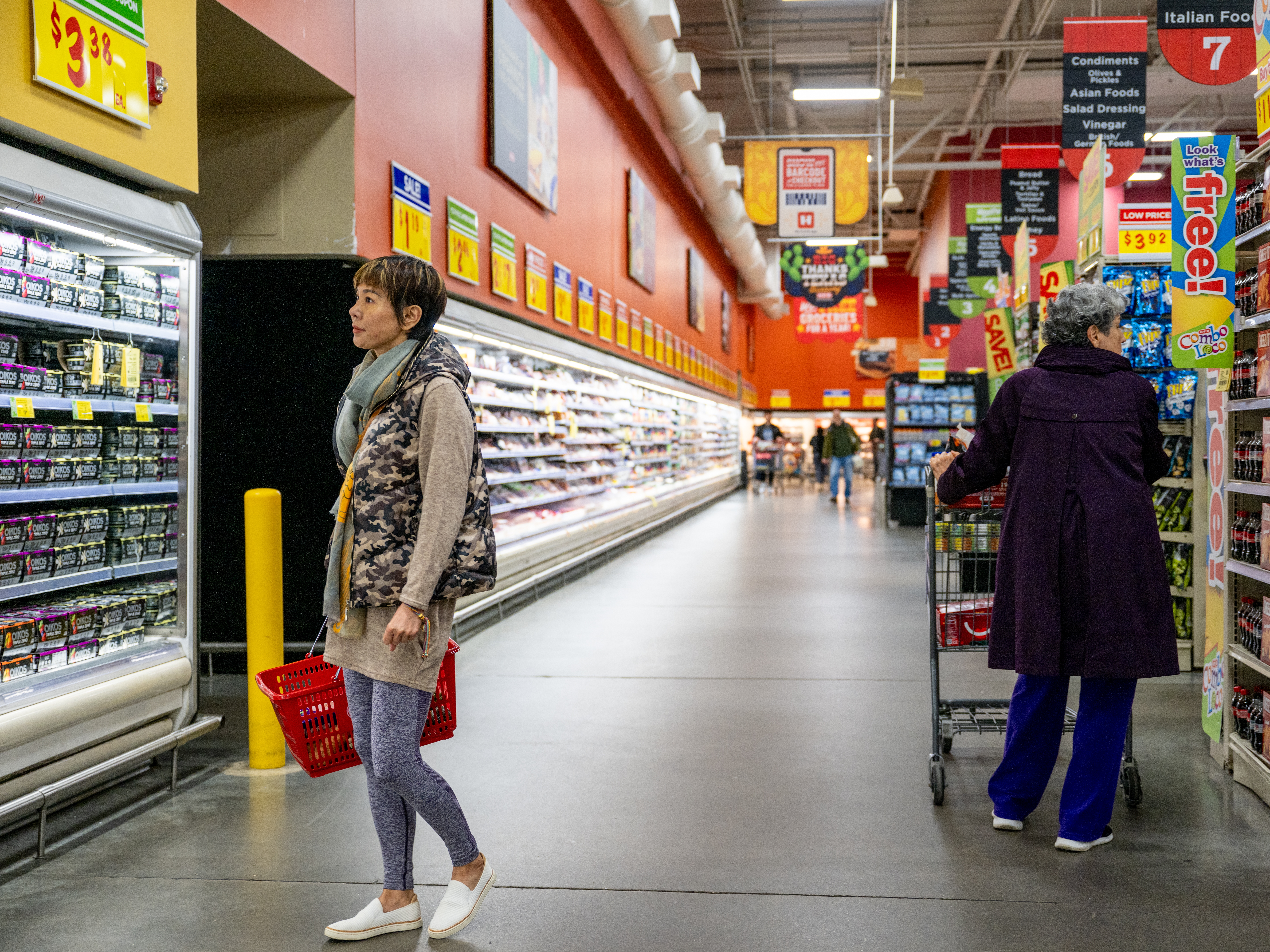 caption: Customers shop for produce at a grocery store on Feb. 12, 2025 in Austin, Texas.