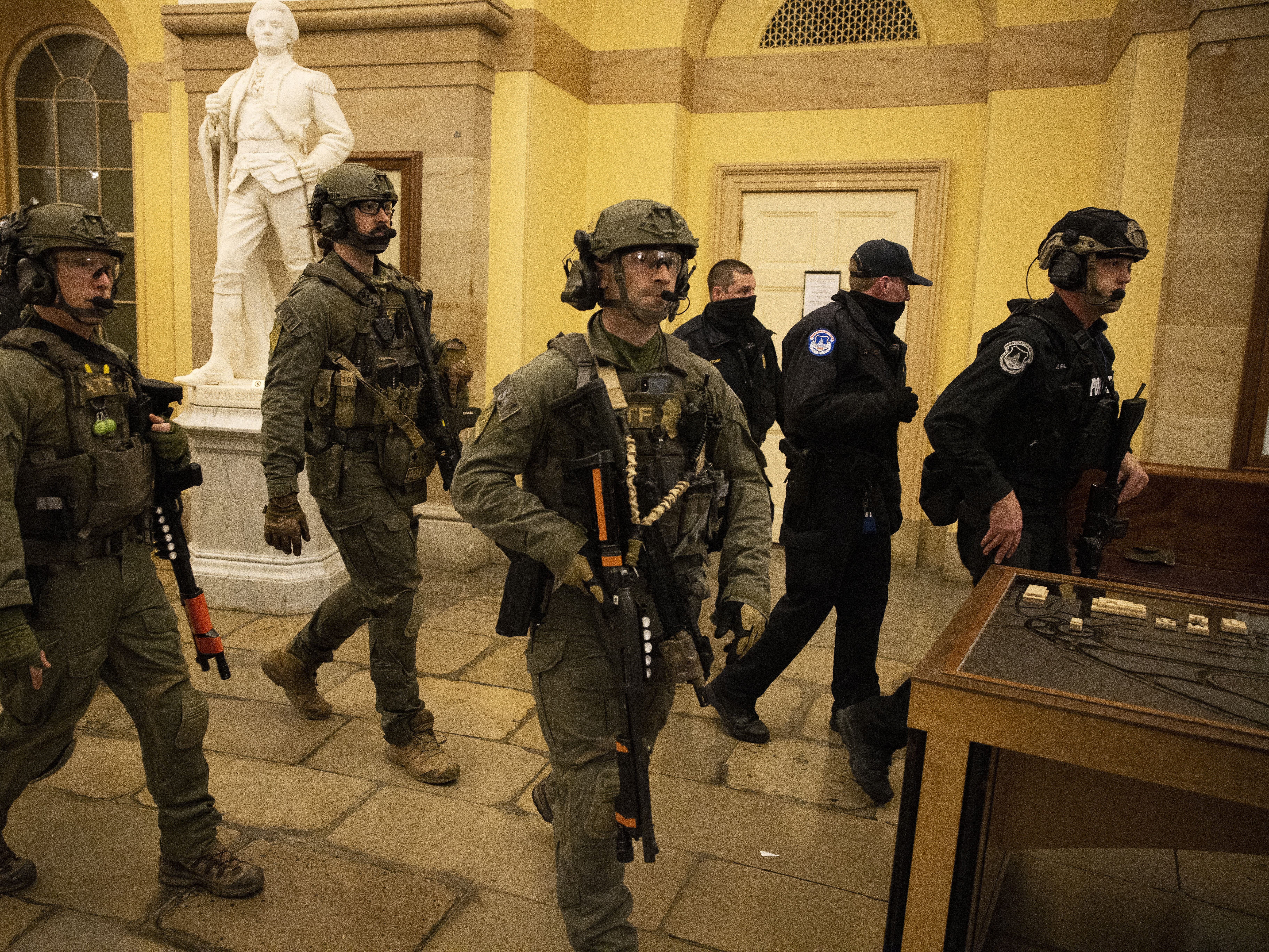 caption: FBI and ATF law enforcement push out supporters of President Trump as they protested inside the U.S. Capitol on Jan. 6, 2021, in Washington, D.C.