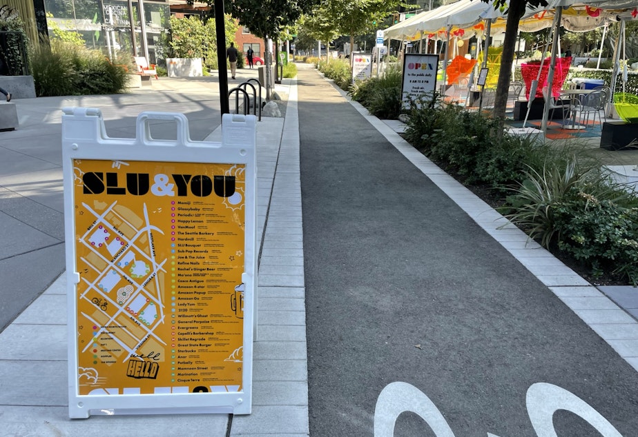 Caption: SLU & You, part of Amazon's marketing campaign to raise awareness of companies on campus. Visible to the right, outdoor shelters created by Amazon to liven up 6th Avenue