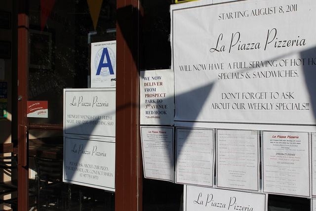 caption: The New York City Health Department conducts unannounced inspections of restaurants at least once a year. Each violation of a regulation earns a certain number of points.