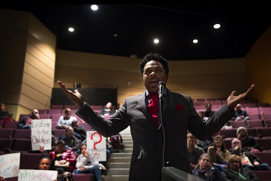 caption: Kevin Amos addresses Seattle Public Schools leadership about teacher misconduct issues during a public meeting on Thursday, February 13, 2020 at Garfield High School in Seattle. 