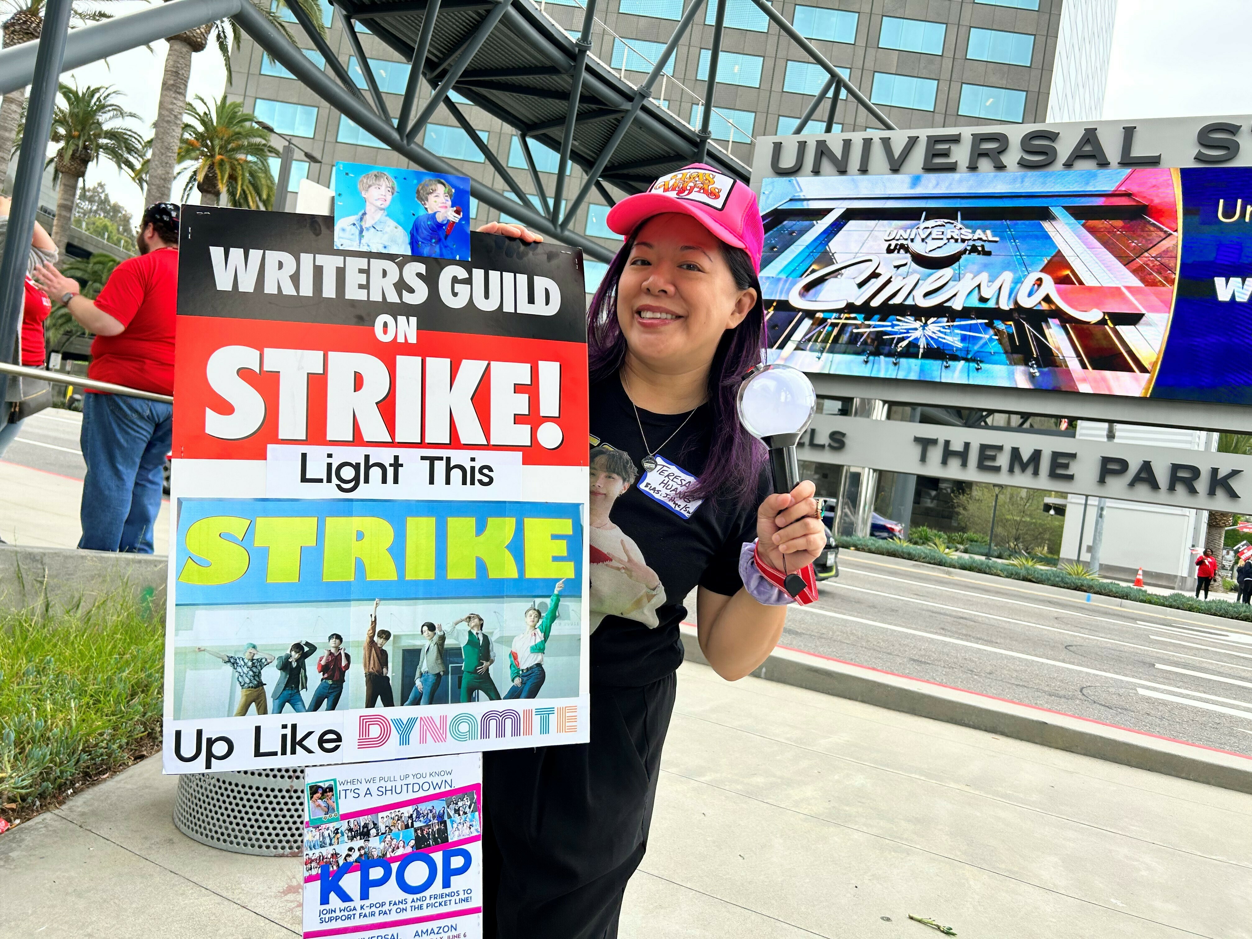 caption: Teresa Huang is a member of the WGA and SAG-AFTRA. She organized a special K-pop day at the picket line outside Universal Studios this week.
