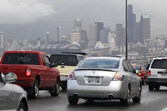 caption: The Seattle skyline behind heavy traffic on northbound Interstate 5 in 2011.