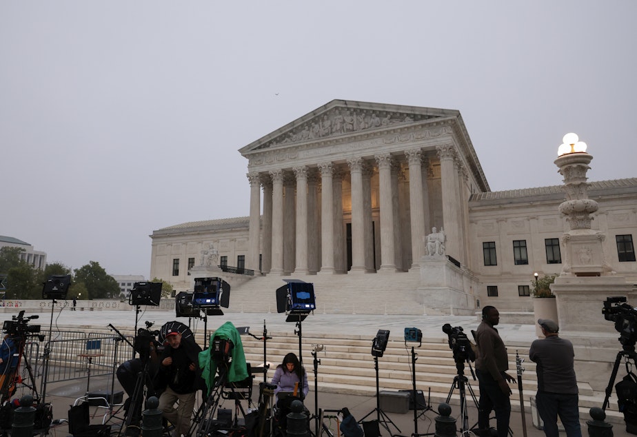 caption: TV camera crews station in front of the Supreme Court building on Tuesday in Washington, D.C.