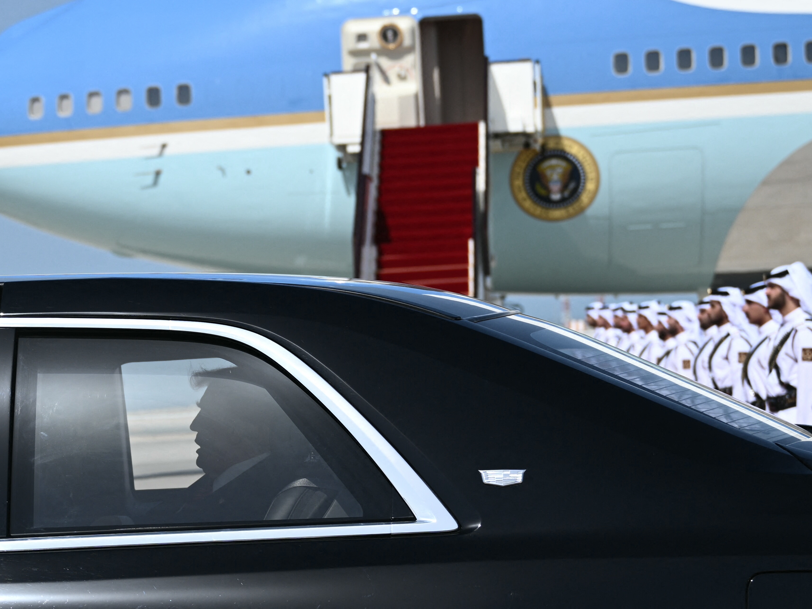 caption: President Trump arrives in the Qatari capital Doha on Wednesday. Trump touched down at Hamad International Airport, with relations between the two governments in the spotlight over Qatar's offer to Trump of a $400 million luxury aircraft to serve as a new Air Force One.