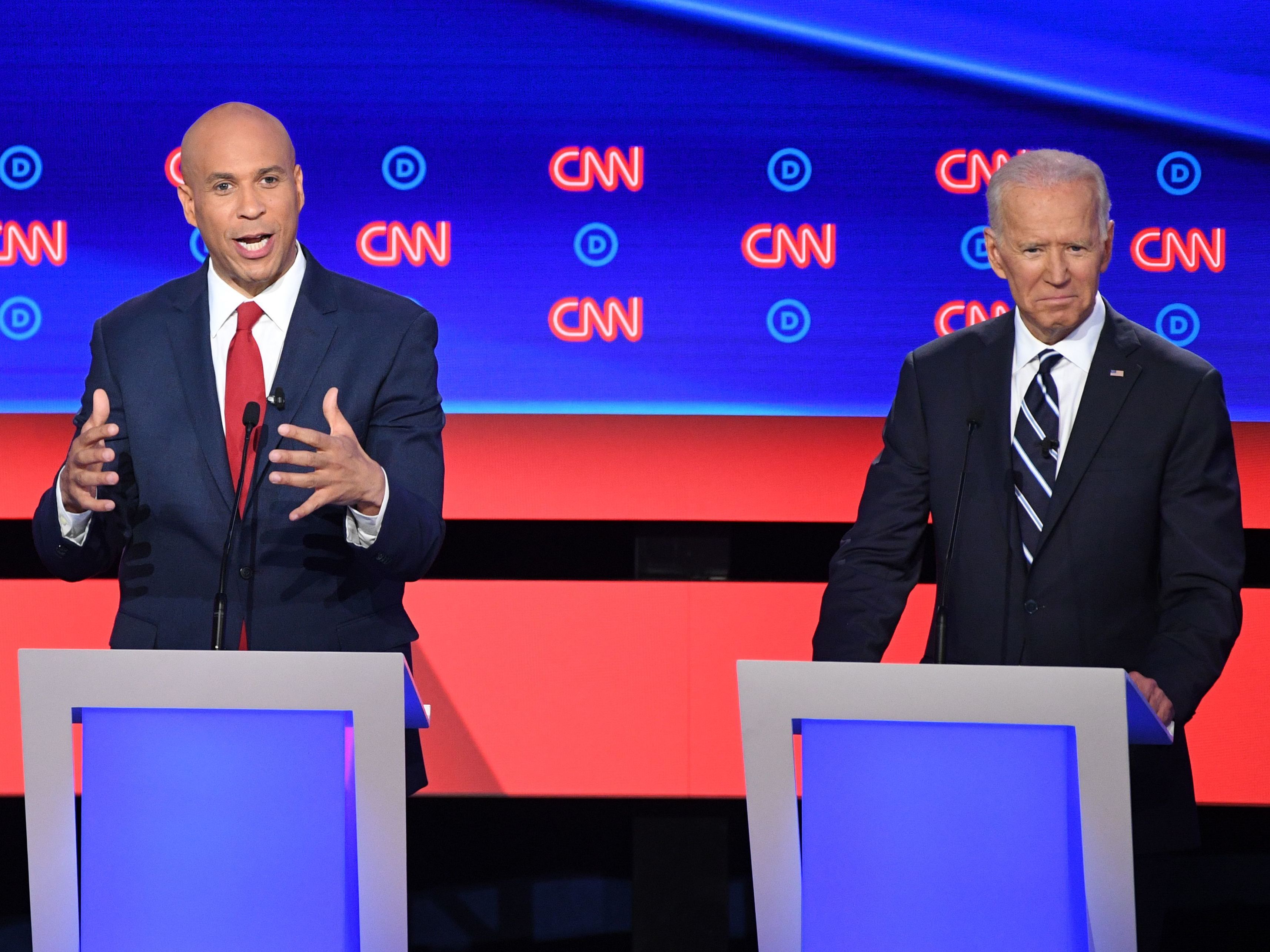 caption: New Jersey Sen. Cory Booker delivers his closing statement flanked by former Vice President Joe Biden during the Democratic presidential debate in Detroit on Wednesday night. Booker pressed Biden on his record on criminal justice.