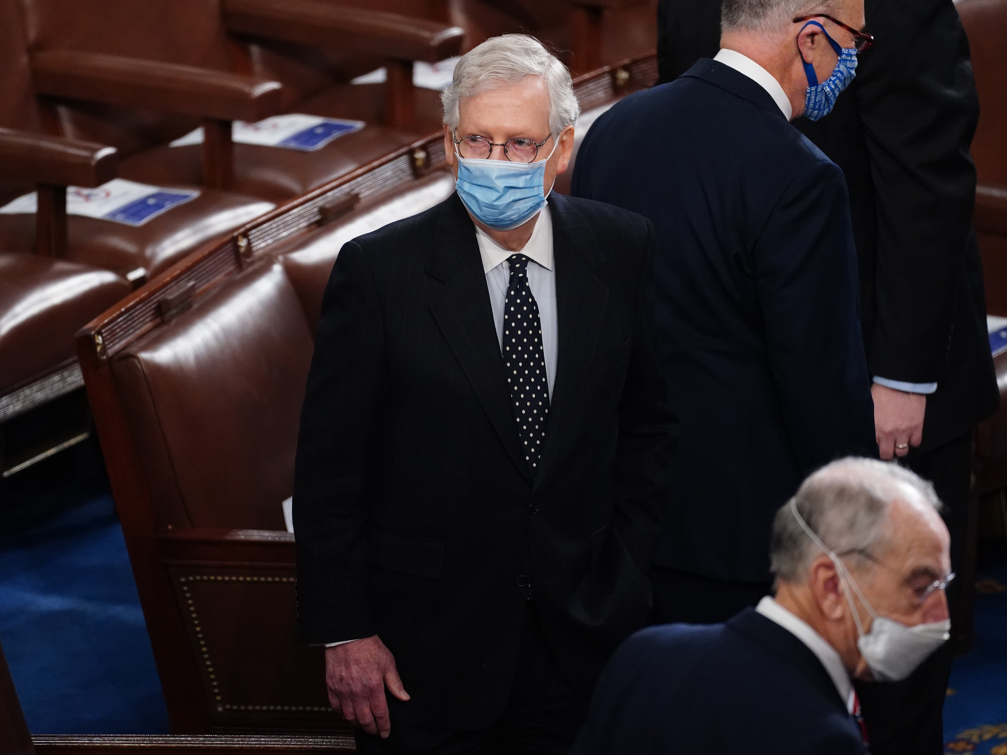 caption: Senate Majority Leader Mitch McConnell arrives Wednesday for the Electoral College vote certification for President-elect Joe Biden, during a joint session of Congress.