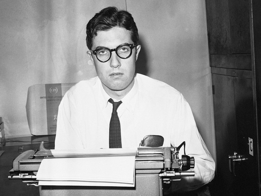 caption: Journalist Neil Sheehan, pictured at the time as a reporter for UPI, died recently at the age of 84.