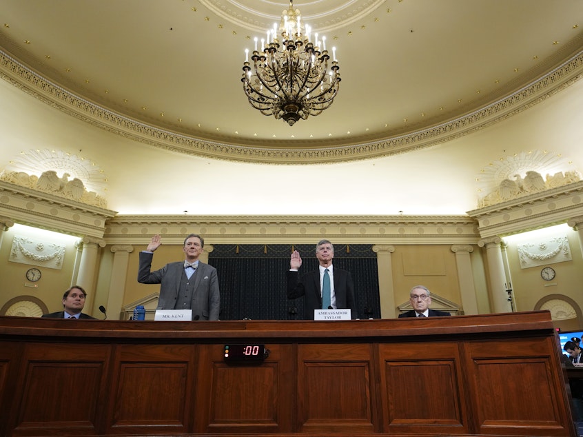 caption: Deputy Assistant Secretary for European and Eurasian Affairs George Kent and top U.S. diplomat in Ukraine William Taylor are sworn in prior to testifying before the House Intelligence Committee on Wednesday.