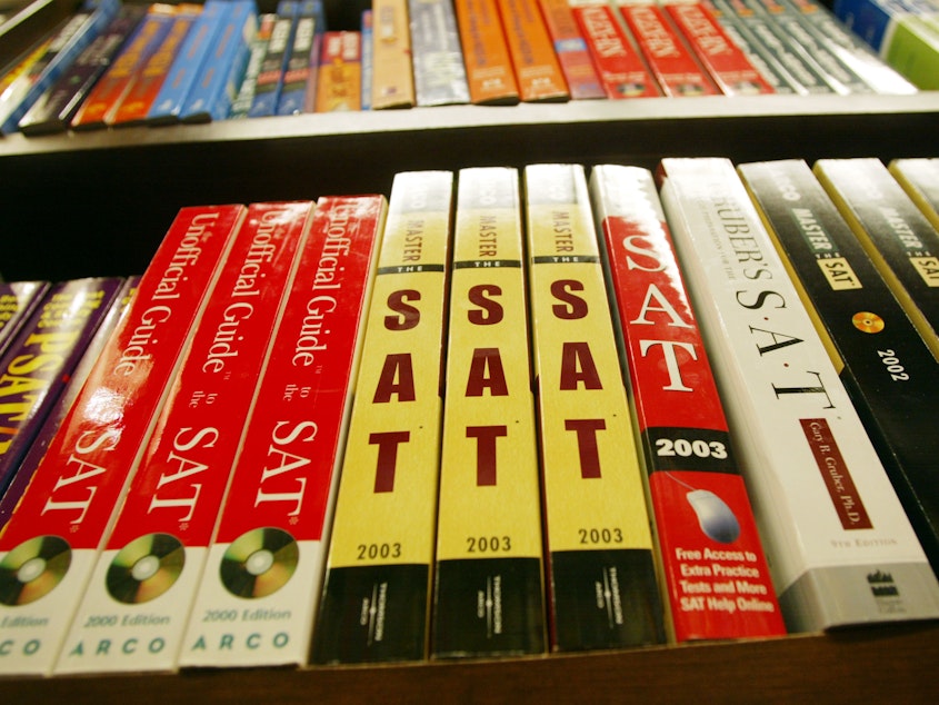 caption: SAT test preparation books sit on a shelf at a bookstore in New York City.