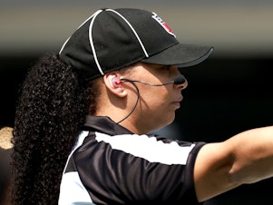caption: Line judge Maia Chaka signals during the game between the Carolina Panthers and the New York Jets at Bank of America Stadium on Sept. 12 in Charlotte, N.C. Chaka made history as the first Black woman to officiate an NFL game.