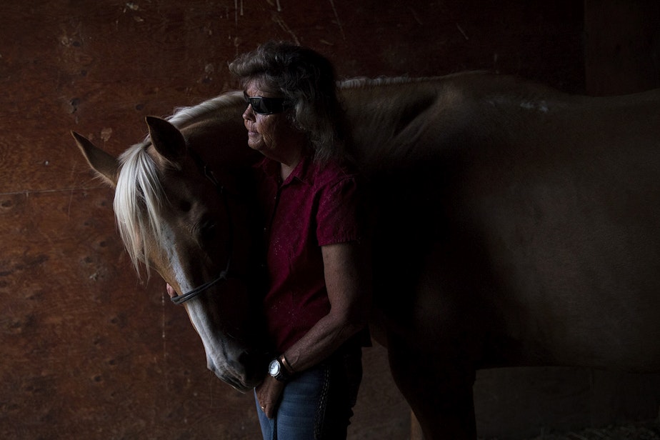 caption: Julie Hensley poses for a portrait with her horse, Hot Rod, in her barn on Tuesday, July 16, 2019, in Brewster. Julie lost her sight in her early twenties when the horse that she was riding fell, causing her retinas to detach. 