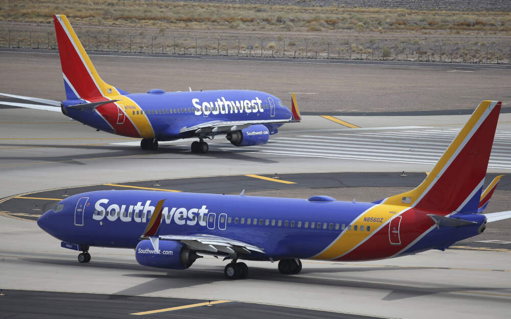 caption: Southwest Airlines planes at Phoenix Sky Harbor International Airport in Phoenix. (Ross D. Franklin/AP)