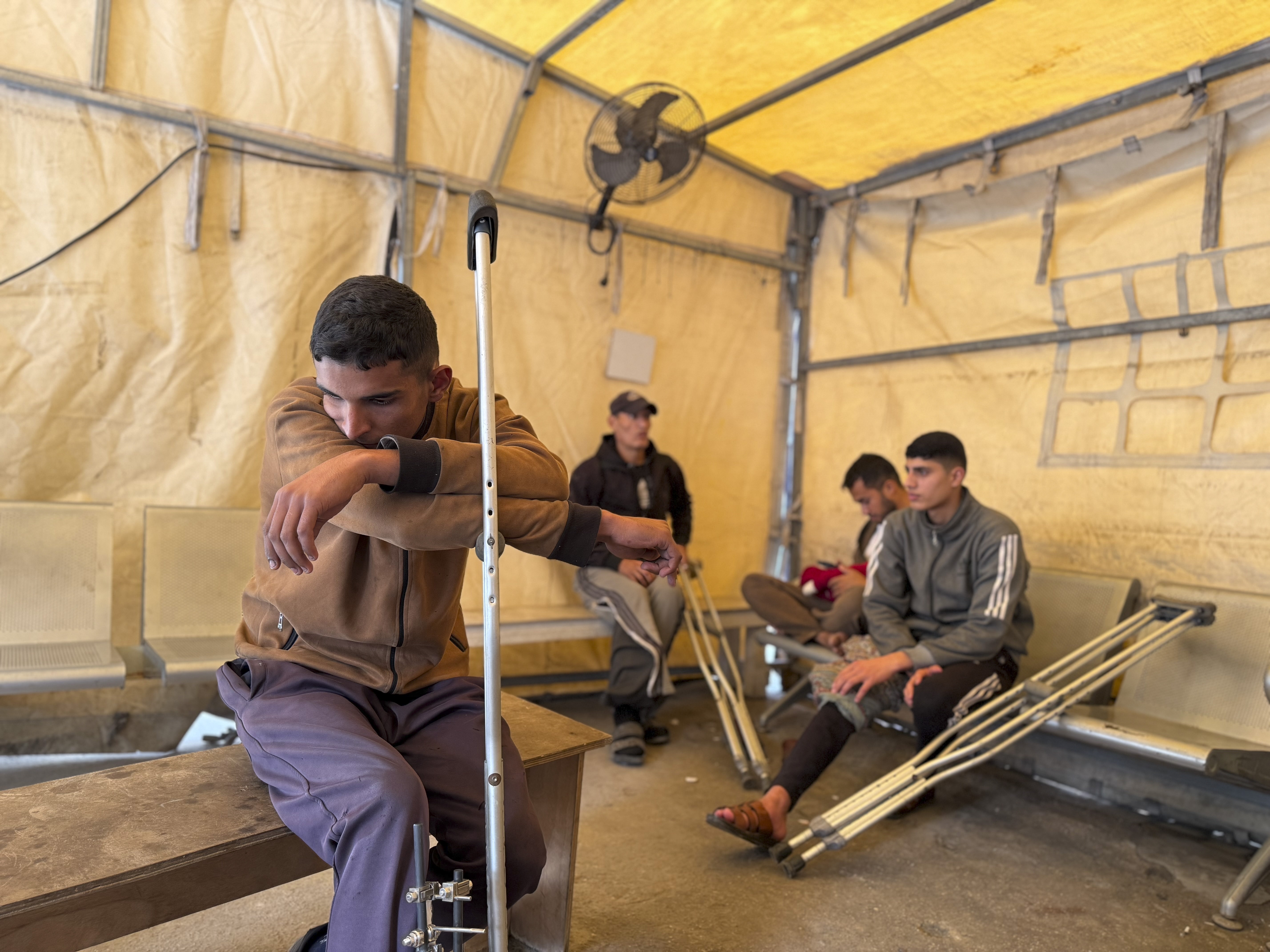 caption: Patients sit in a clinic in Gaza City run by Doctors Without Borders, known by its French initials MSF, on Dec. 31, 2025.