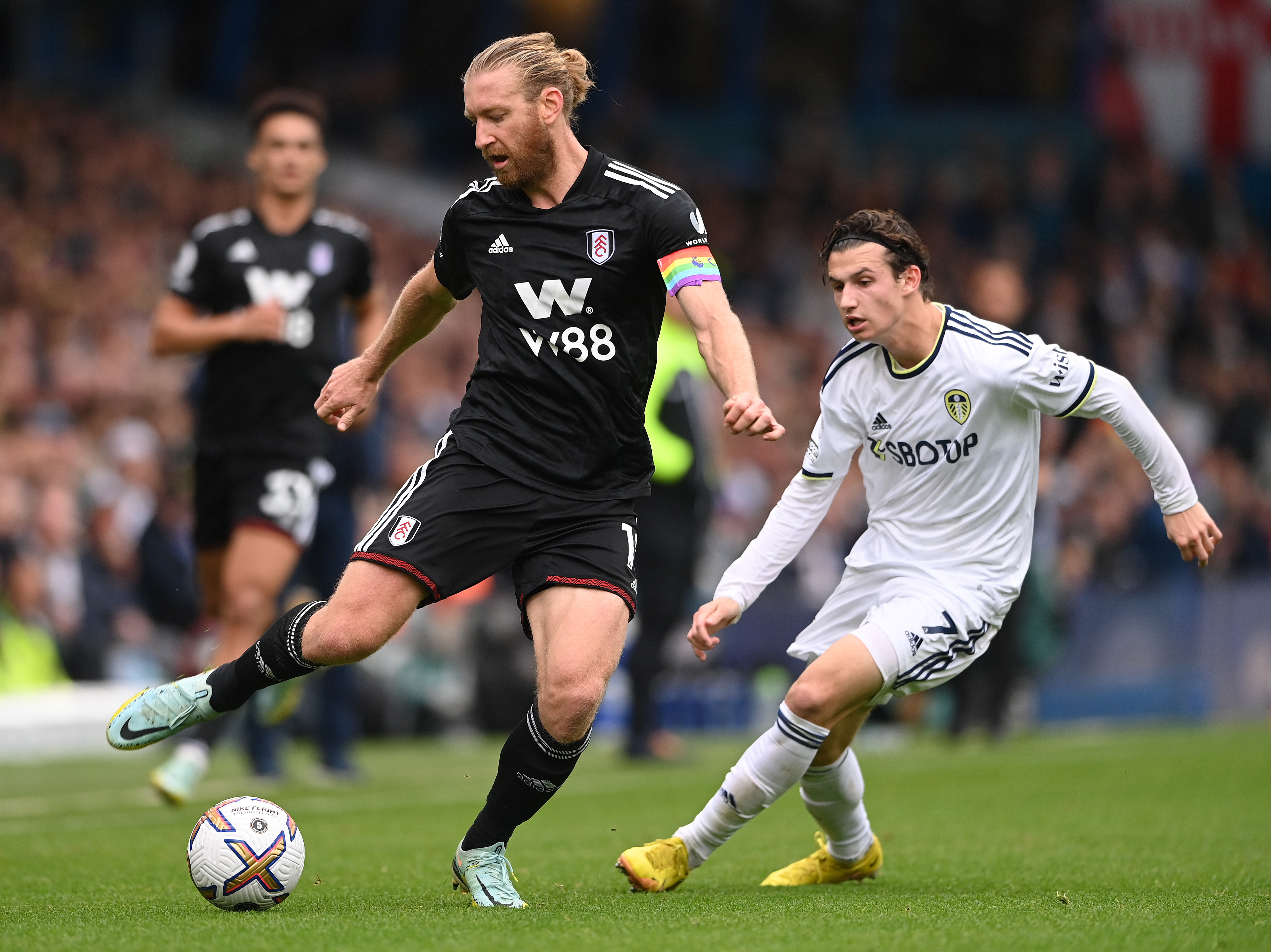 caption: Two U.S. men's national team players — Tim Ream, left, and Brenden Aaronson, right — playing for their respective English Premier League teams in October.