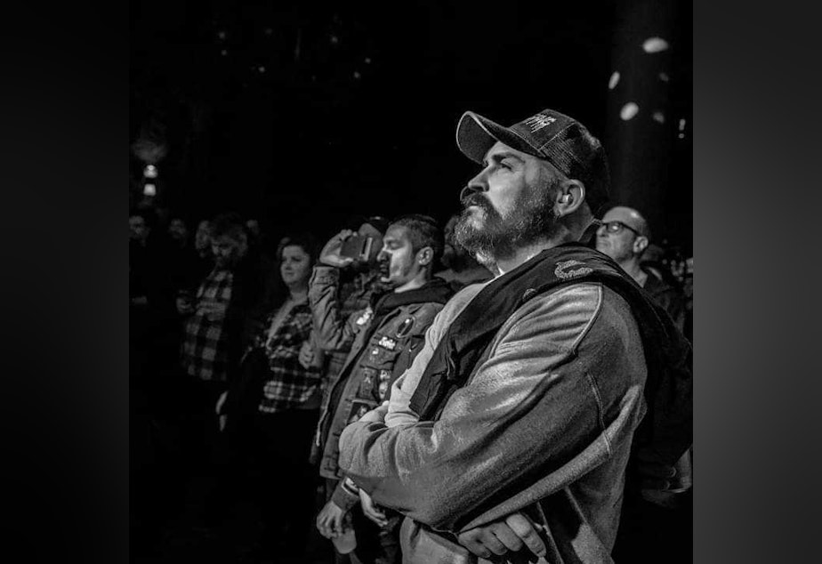 caption: KUOW announcer Kevin Diers doing one of the things he loved most, going to shows and hearing live music in Seattle.