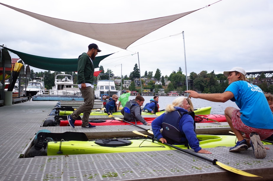 caption: These Paddlers at the Agua Verde Paddle Club on Portage Bay were among the first on the water when the club reopened on Thursday