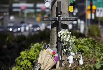 caption: A memorial is shown near the scene of the fatal crane collapse on Monday, April 29, 2019, on Mercer Street in Seattle.