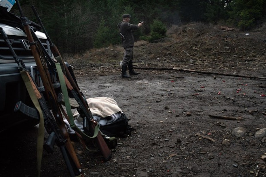 caption: <p>Ross Eliot, an activist and proponent of armed self-defense, fires a handgun on Feb. 2, 2019 in Hood River, Ore.</p>