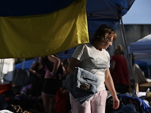 caption: A makeshift shelter for Ukrainians in Tijuana, Mexico. Thousands who fled the war have been arriving here and waiting to be admitted by border agents into the United States.