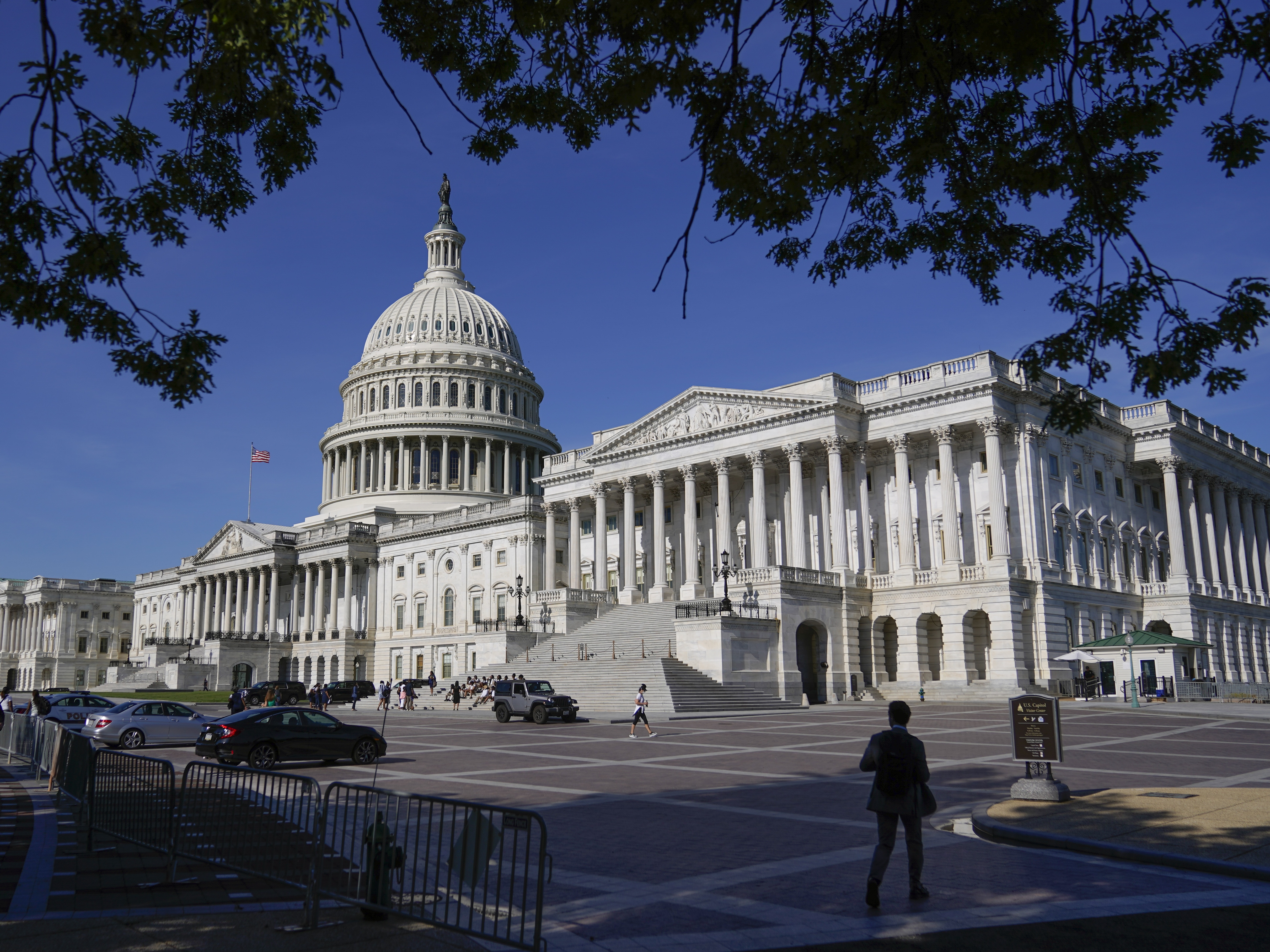 caption: Sun shines on the U.S Capitol dome on Capitol Hill in Washington, D.C., in 2022.