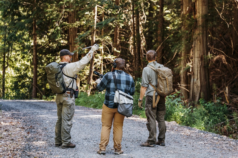 caption: Research scientist Brian Kertson, 'The Wild' producer Matt Martin and host Chris Morgan tracking a cougar in Washington state.