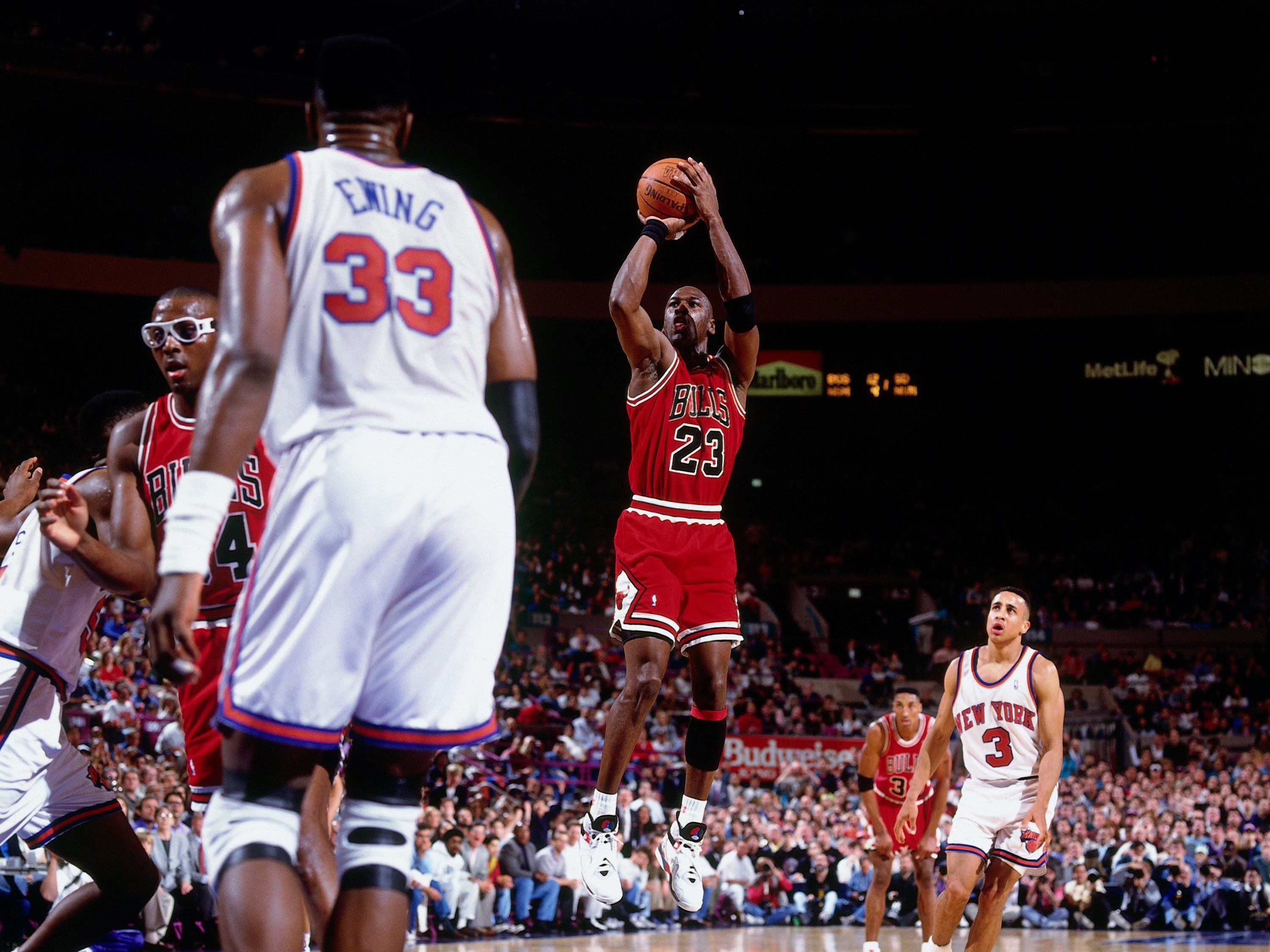 caption: With major professional sports sidelined because of the coronavirus, sports leagues are offering free streaming of their archives. Here, Michael Jordan plays against the New York Knicks in 1992.