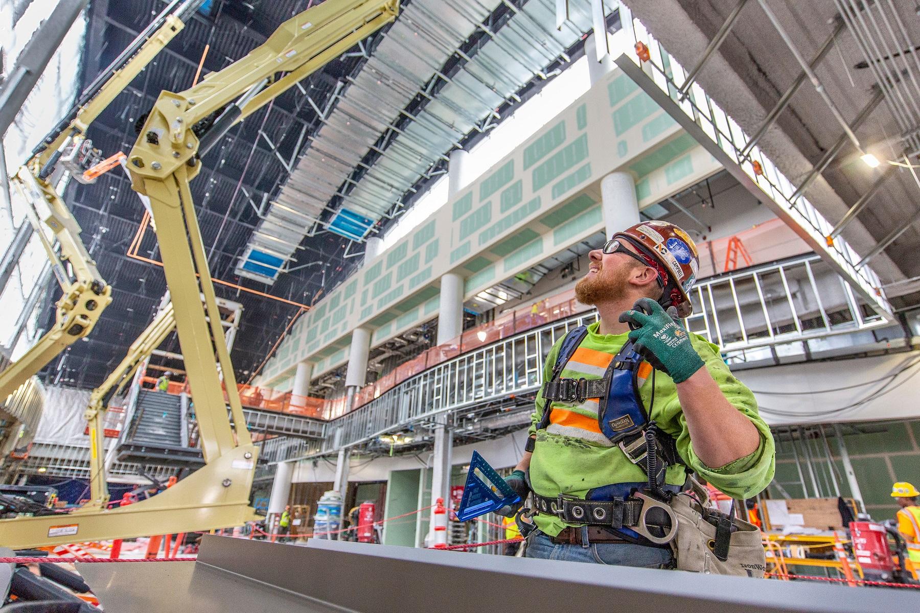 caption: The North Satellite modernization is one of several expensive construction projects at Seattle-Tacoma International Airport proceeding full-steam ahead.