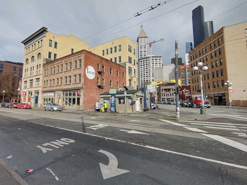 caption: The tiny Main Street Gyros against the Seattle skyline