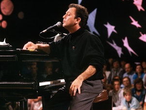 caption: Billy Joel plays in Moscow in 1987.