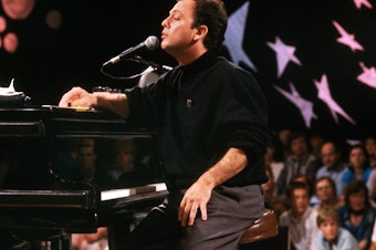 caption: Billy Joel plays in Moscow in 1987.