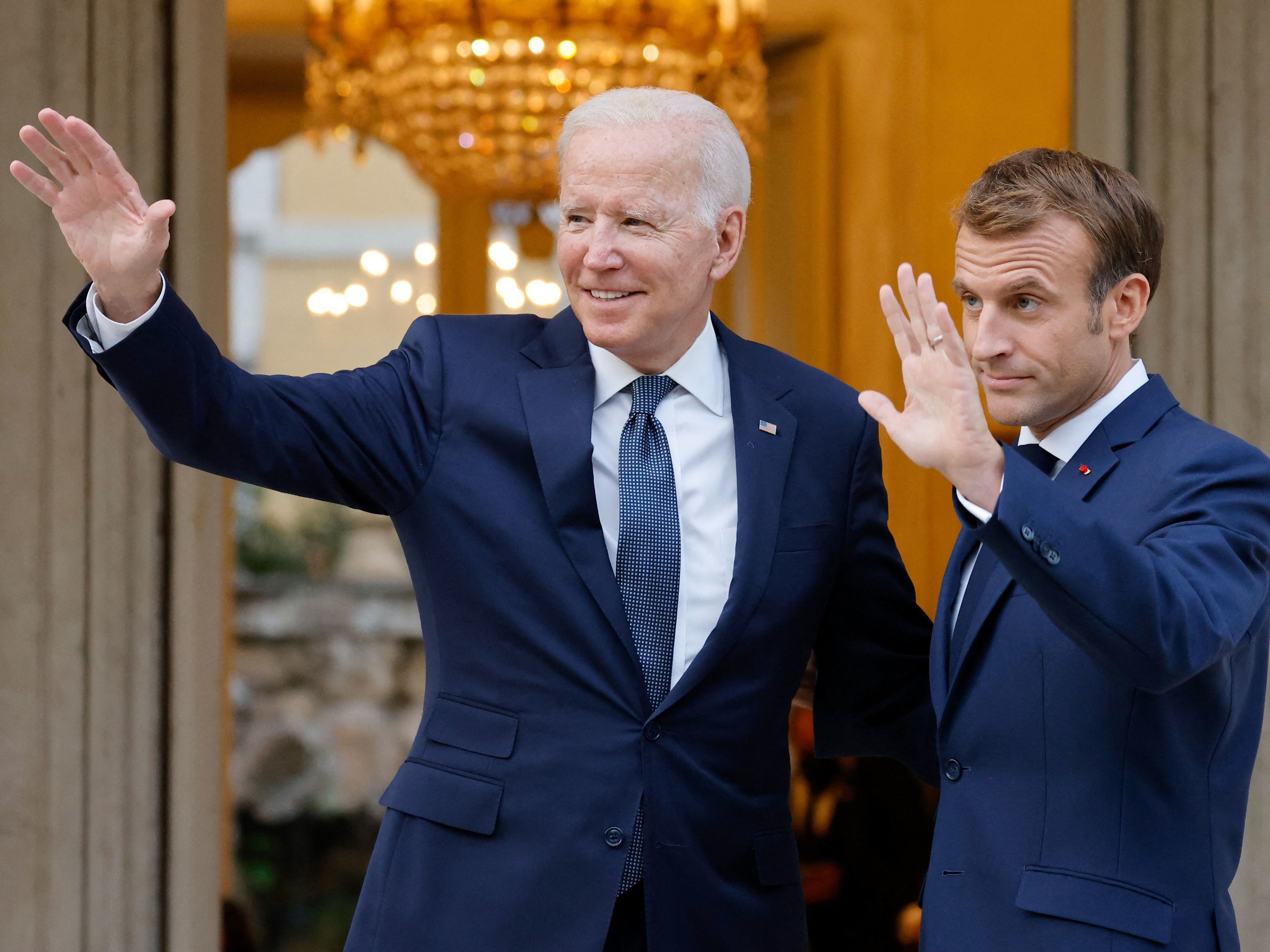 caption: French President Emmanuel Macron welcomes President Biden before their meeting at the French Embassy to the Vatican in Rome on Oct. 29, 2021.