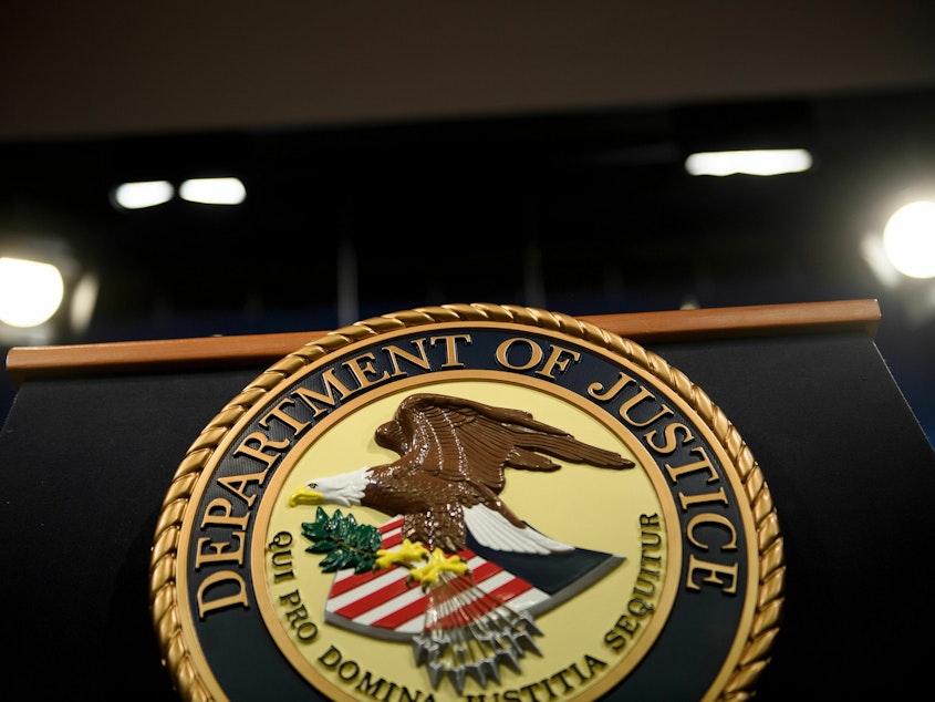 caption: A view of a lectern at the Department of Justice in Washington, D.C., on April 18, 2019. A retired U.S. Army officer has been accused accused of leaking classified national defense information related to the Russia-Ukraine war on a foreign dating website.